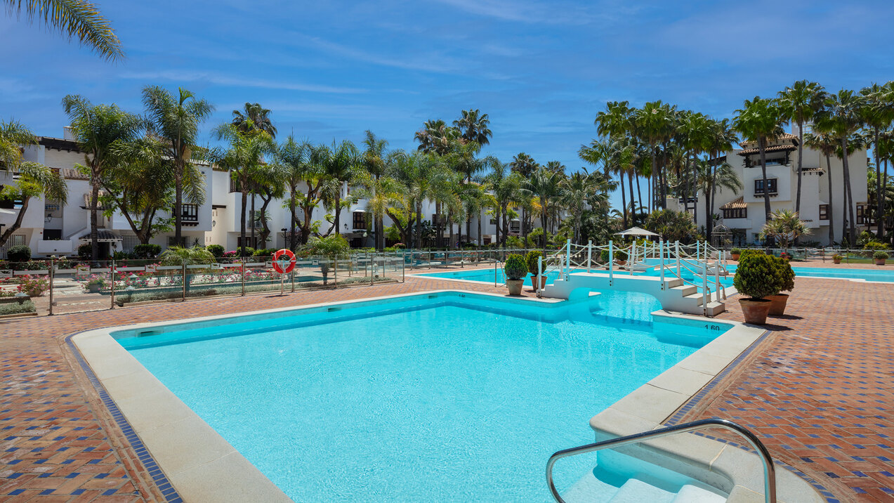 Marina Puente Romano communal pool and gardens