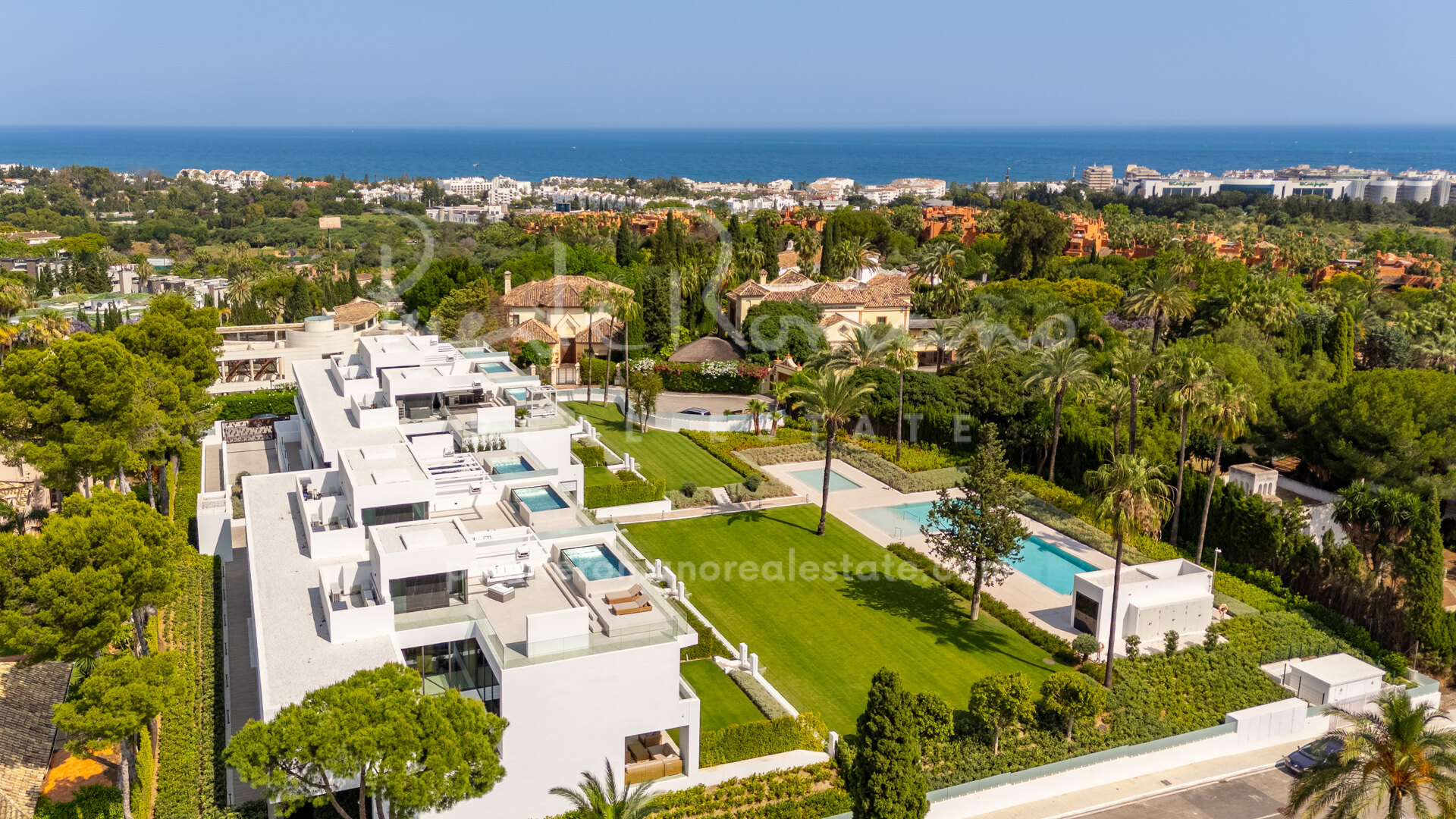 Contemporary semi-detached villa in Nueva Andalucía with rooftop pool and outdoor cinema