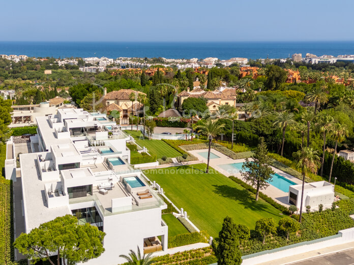 Contemporary semi-detached villa in Nueva Andalucía with rooftop pool and outdoor cinema