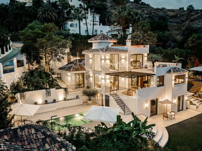 Elegant villa in a gated Nueva Andalucía community with mountain views and luxury wellness features